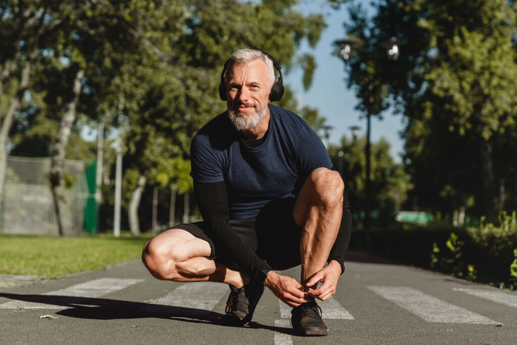 Advita Ortho Patient Education Man running who stopped to tie his shoes