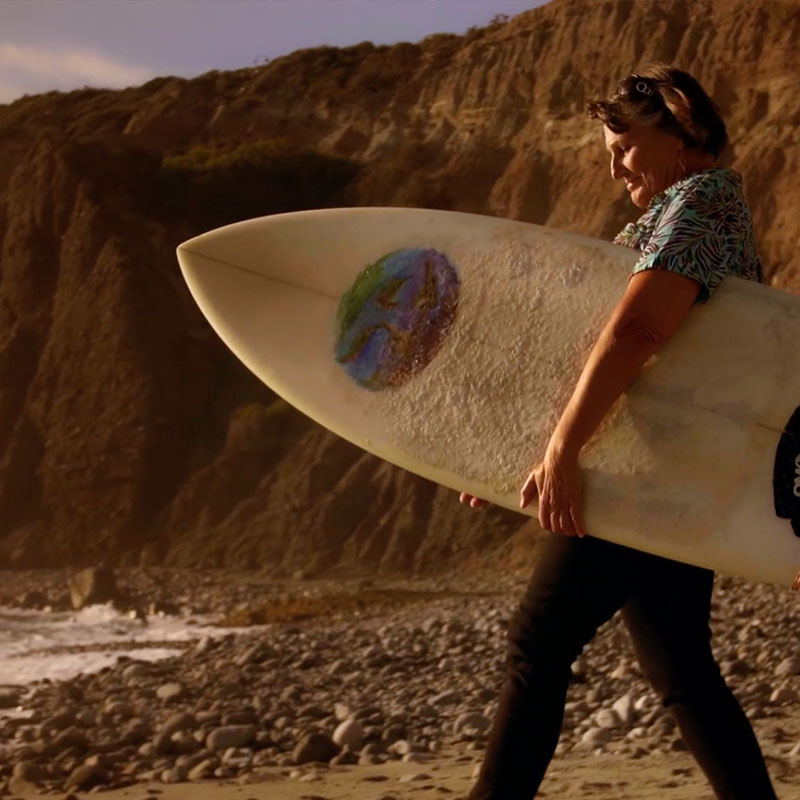 Patient with Surfboard on beach